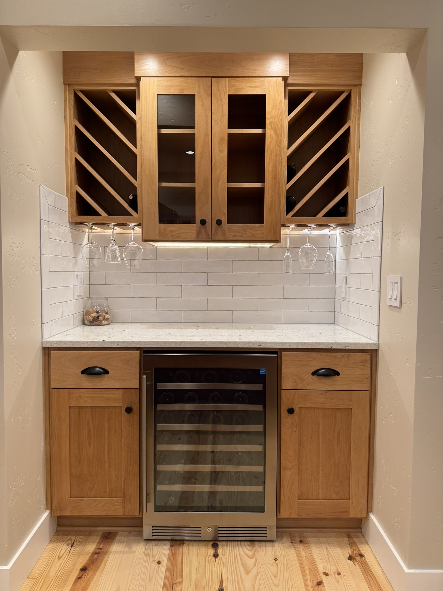 Beverage station detail with open shelving and built-in refrigerator drawer
