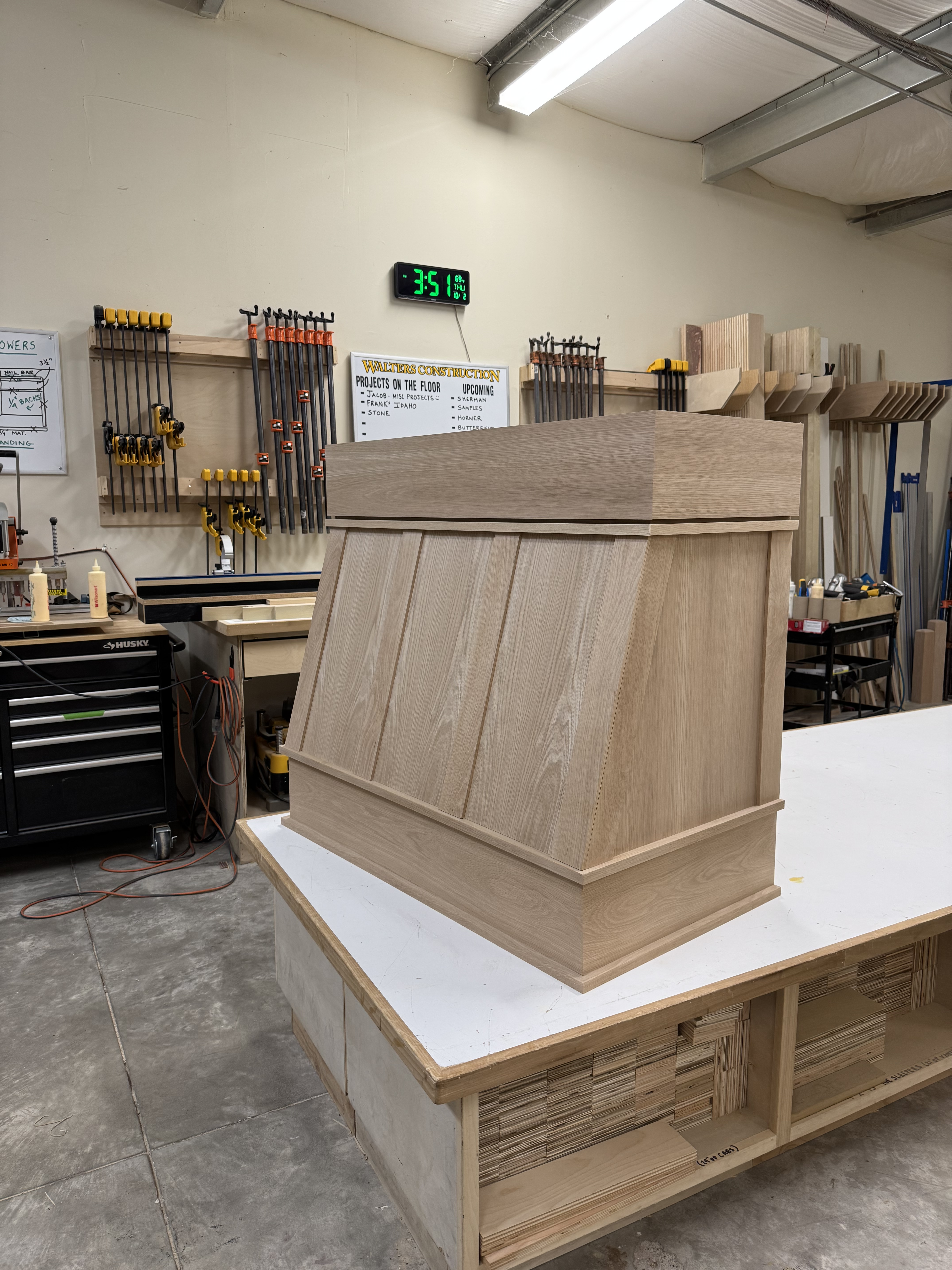 Light wood range hood with cathedral panel front, fresh from glue-up in the shop