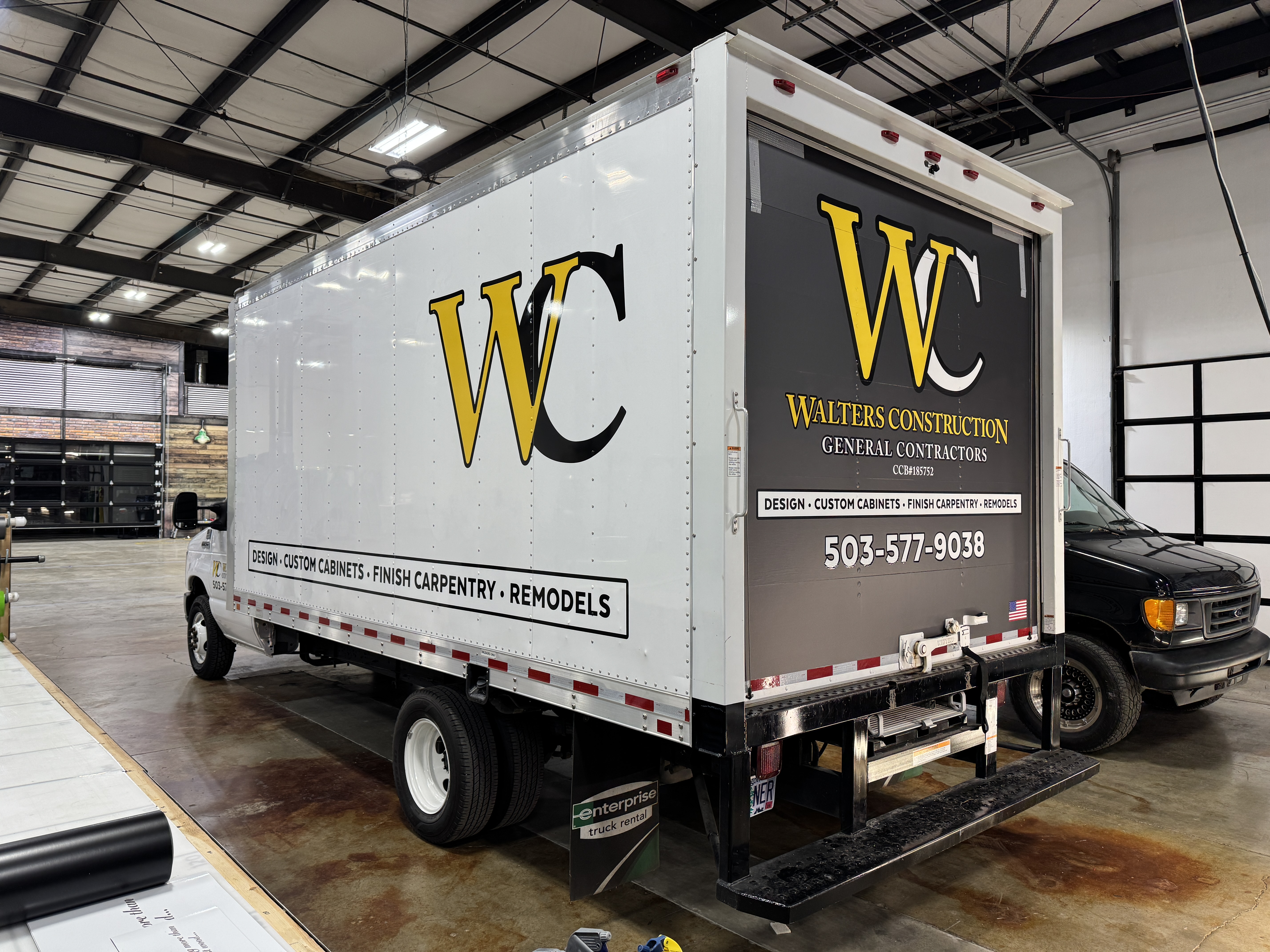 Walter's Custom Cabinets delivery truck on a job site