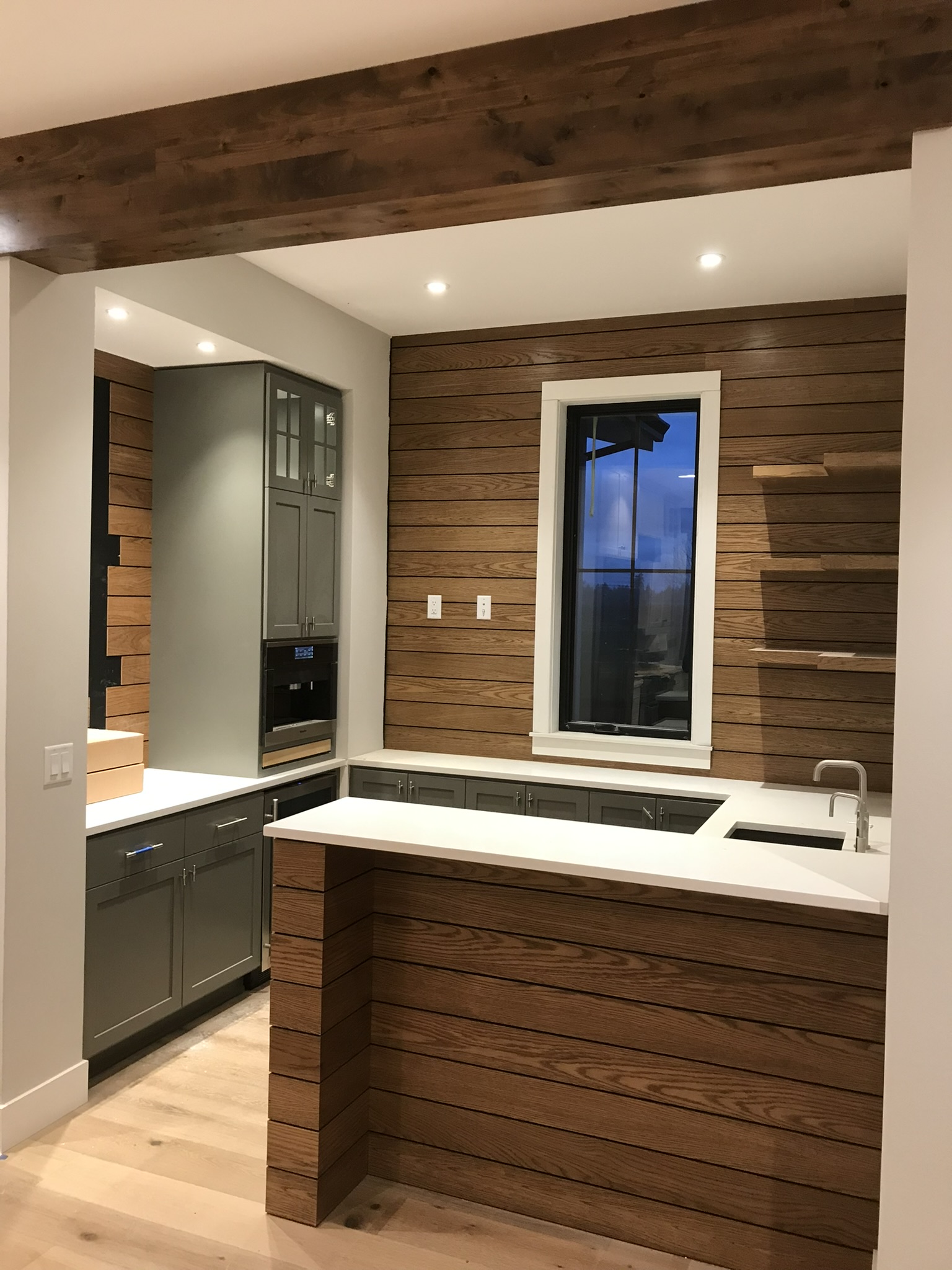 Modern walnut and green kitchen with custom island