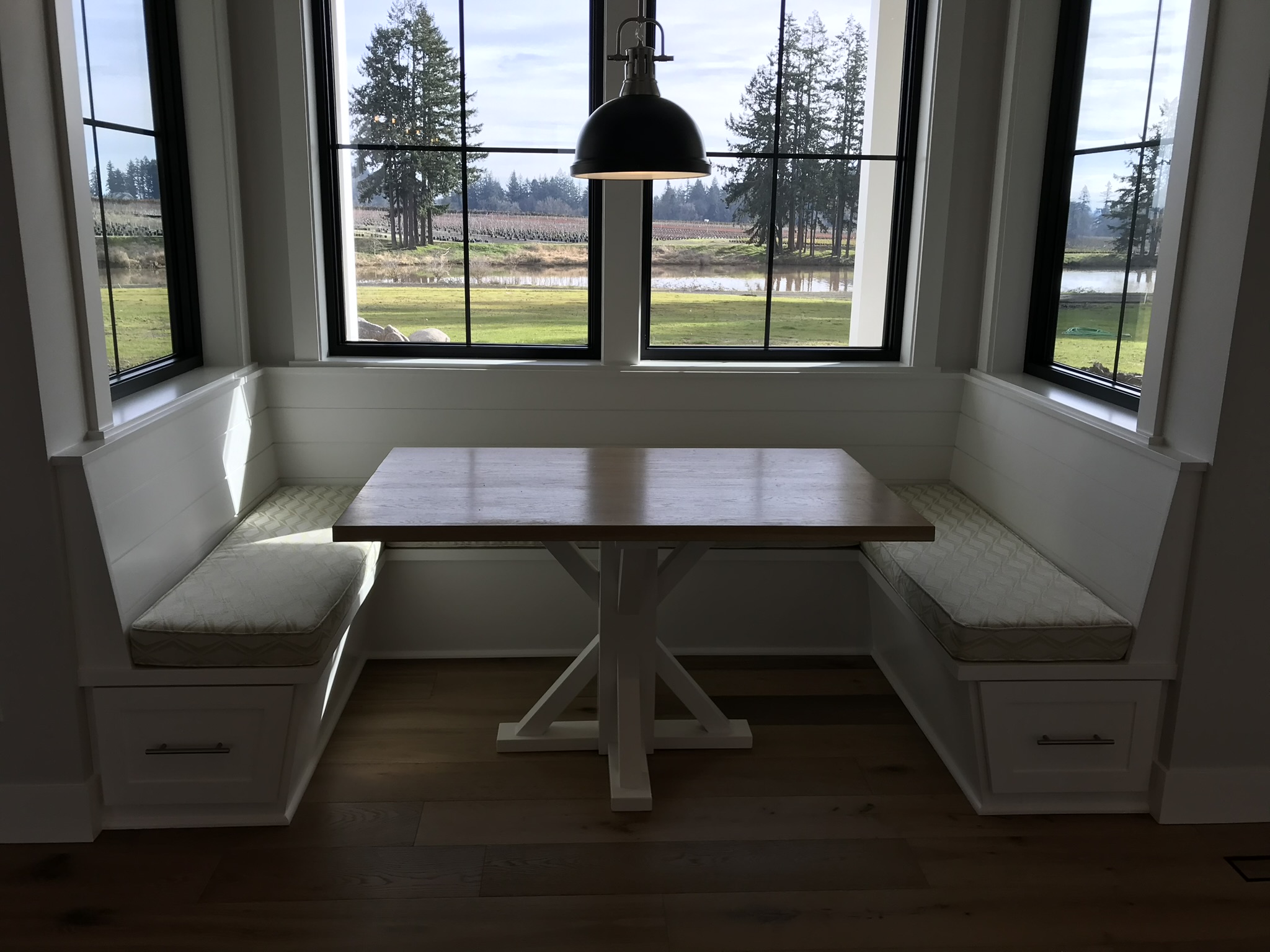 Cushioned breakfast nook seat showing upholstered bench and built-in storage below