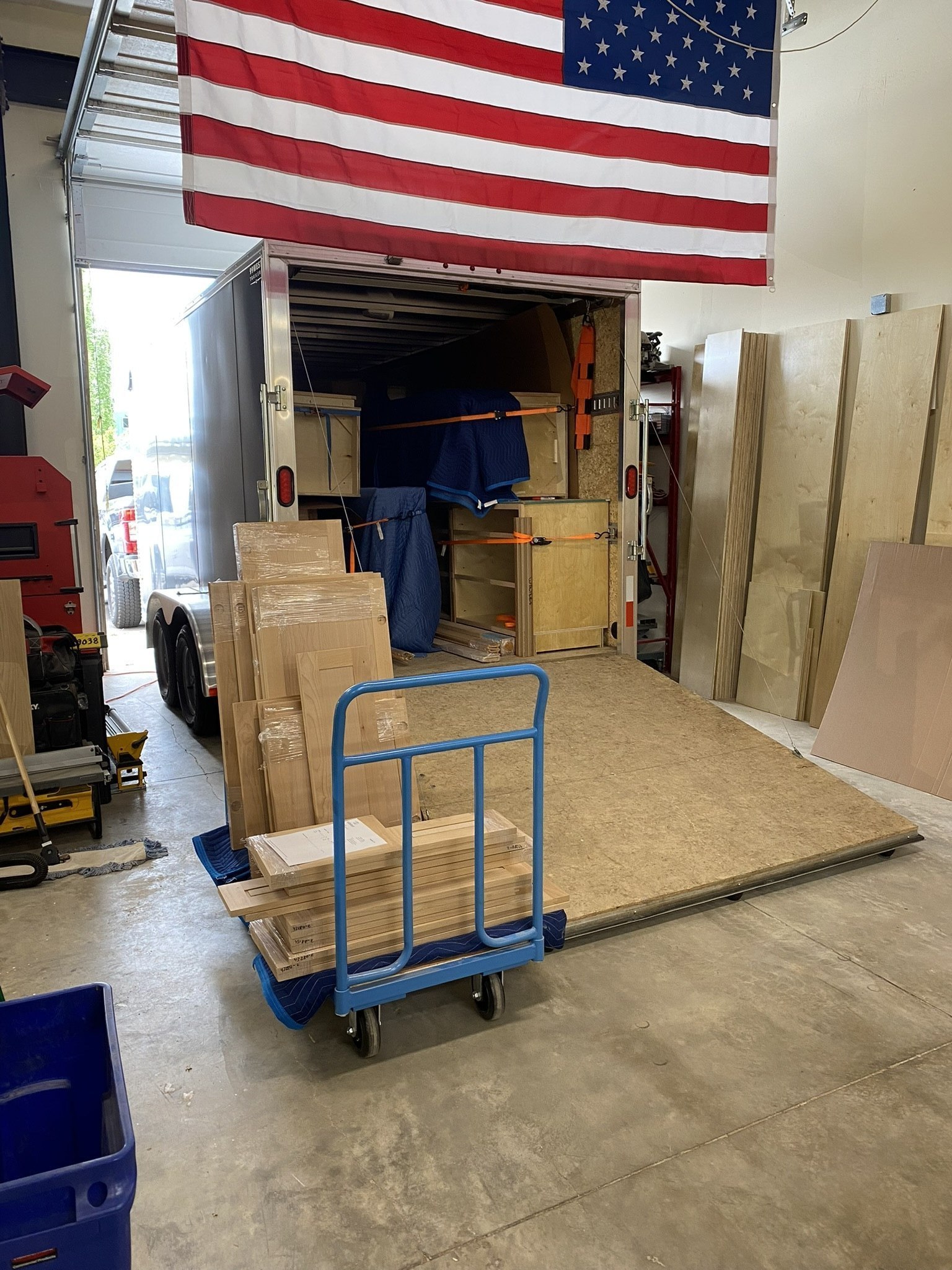 Loading finished cabinets onto the delivery van in the Walter's shop