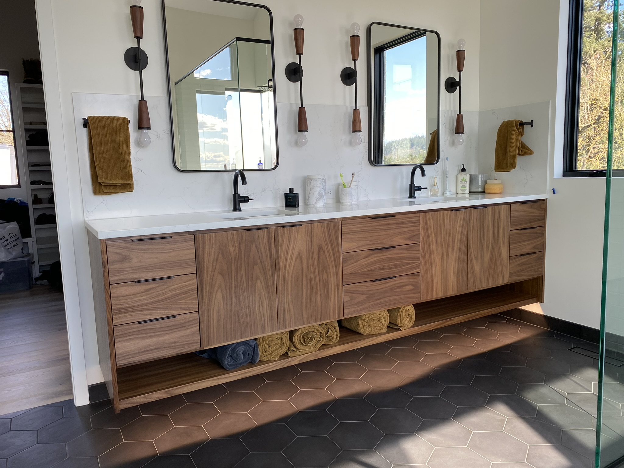 Double walnut bathroom vanity with black hardware